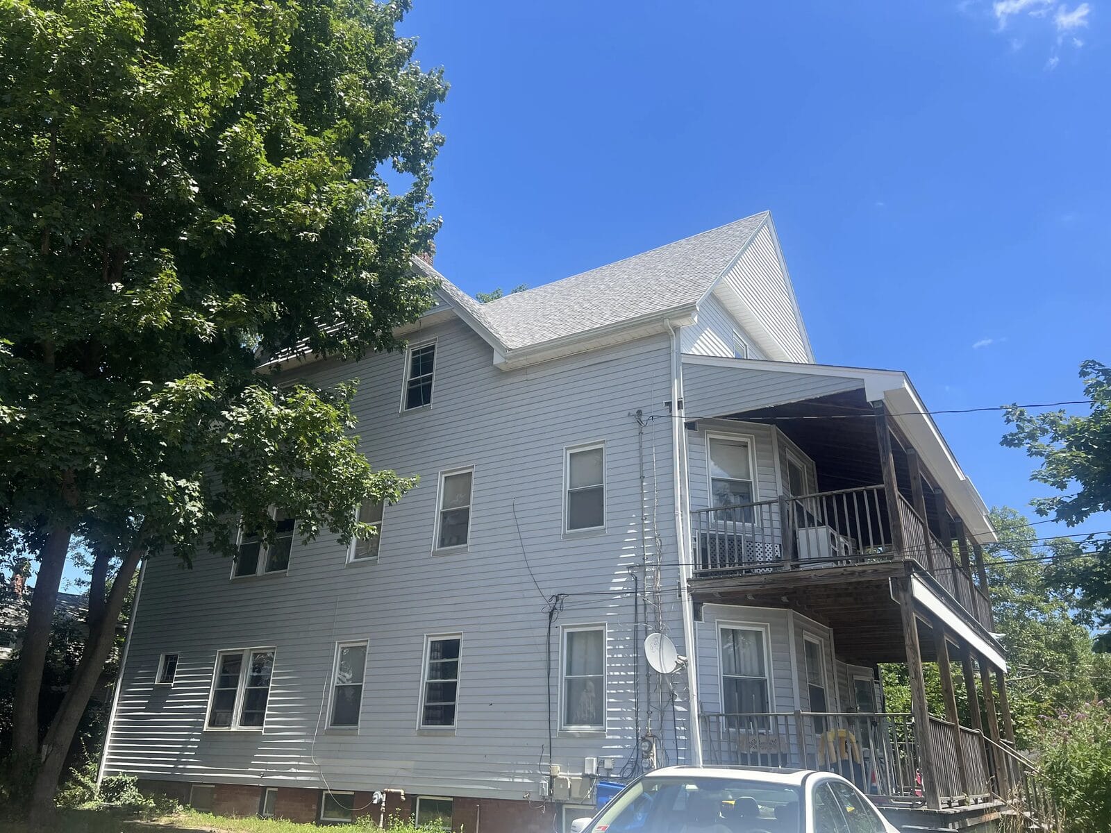 Multi-family three-decker rental property we buy for cash